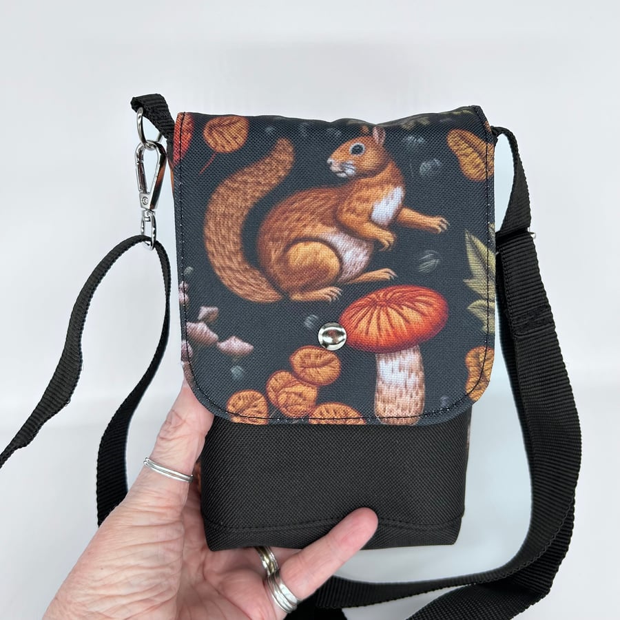 Mini cross body bag with squirrel and mushroom print on waterproof canvas.