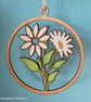 Hanging wooden decoration of a daisy
