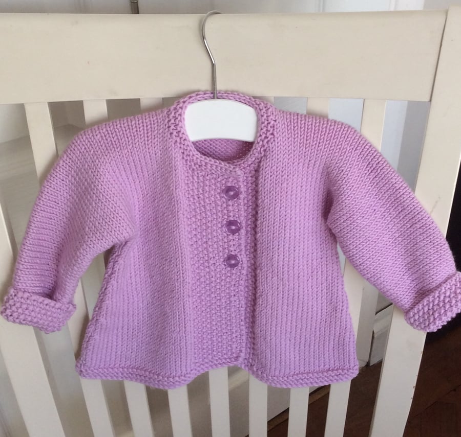 Hand knitted merino wool baby coat