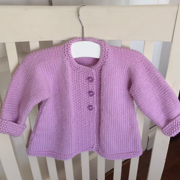 Hand knitted merino wool baby coat