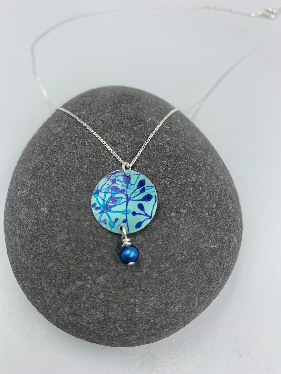 Pale teal and blue aluminium cow parsley circle pendant with pearl 