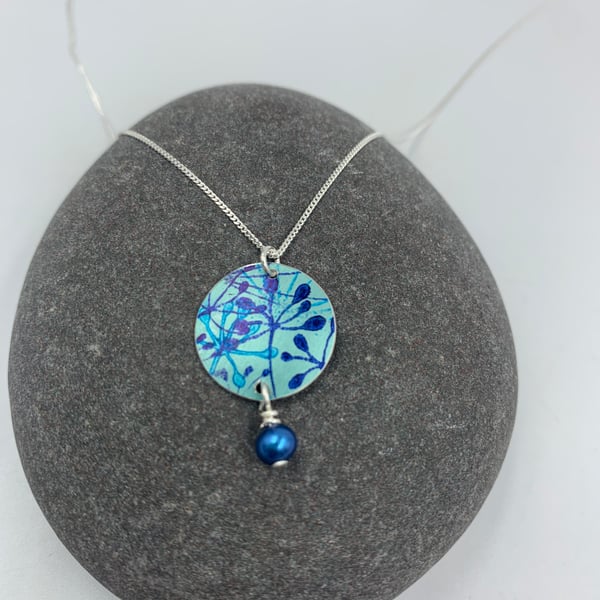 Pale teal and blue aluminium cow parsley circle pendant with pearl 