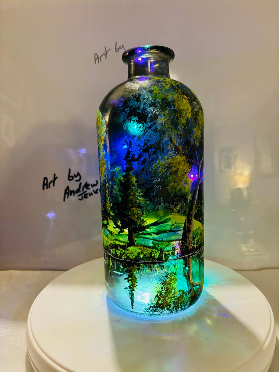 A hand painted and fired glass vase by Andrew Jenkins 