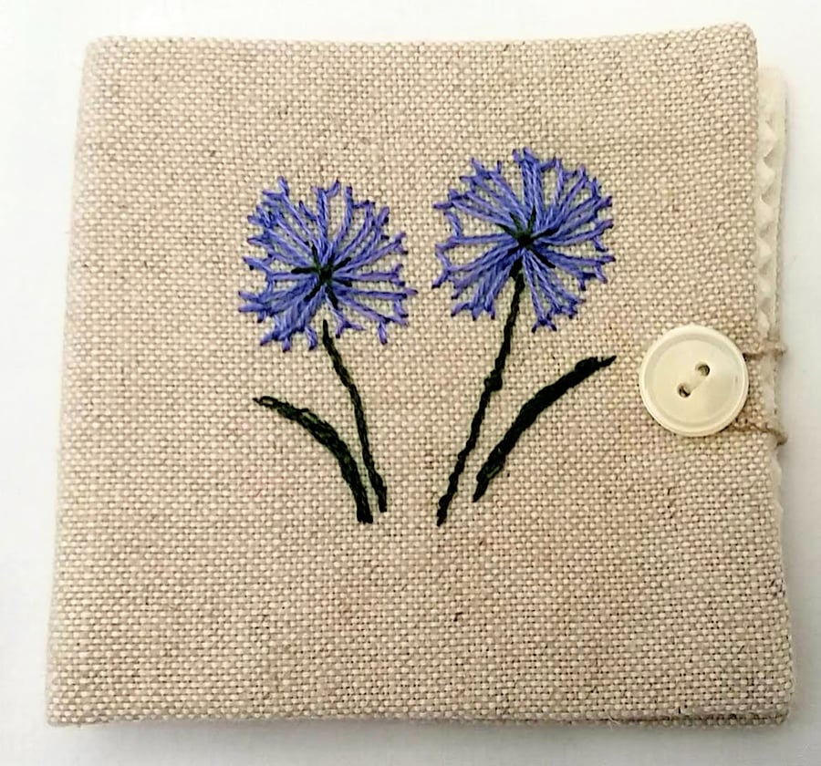  Sewing needle case with hand embroidered flowers.