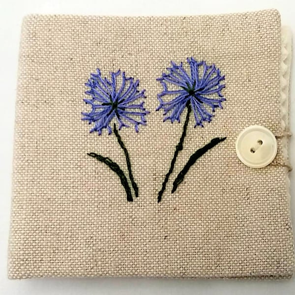  Sewing needle case with hand embroidered flowers.