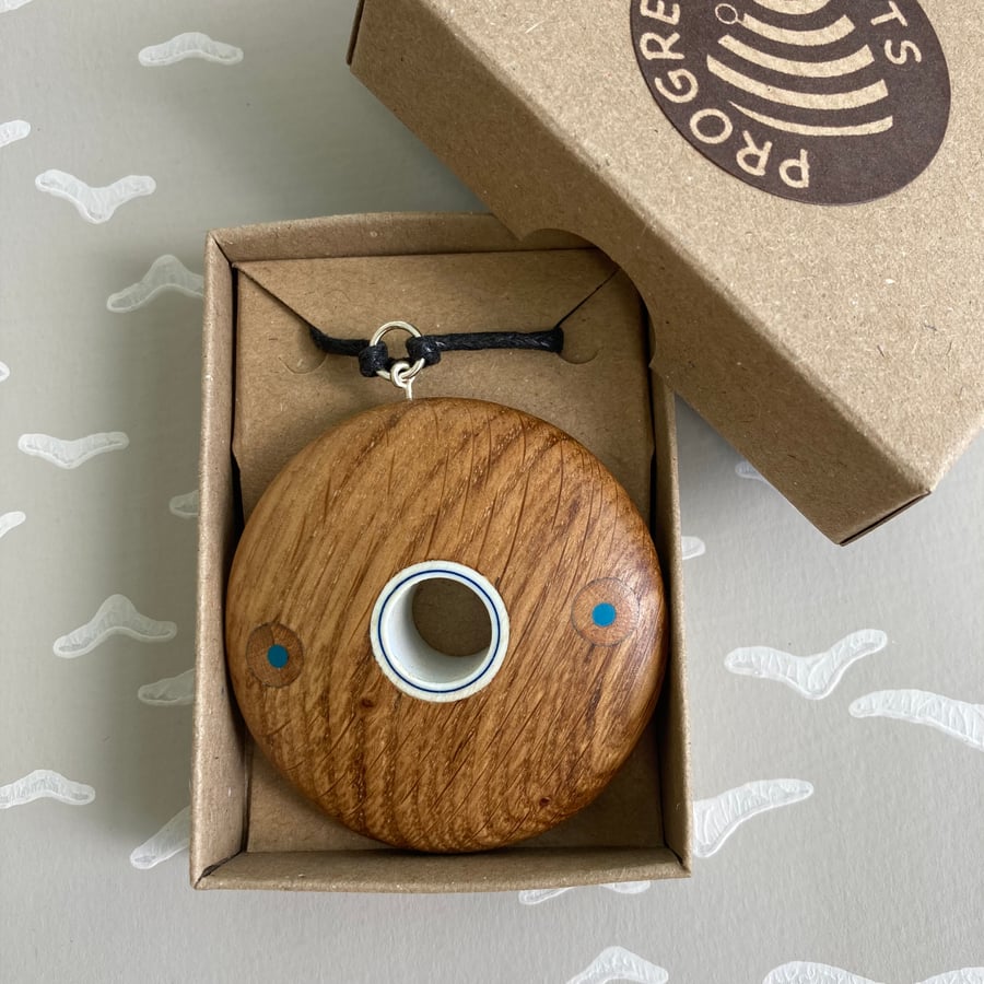 Fun circular oak pendant with pencils & pipe