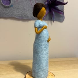 Felted lady cradling her baby bump