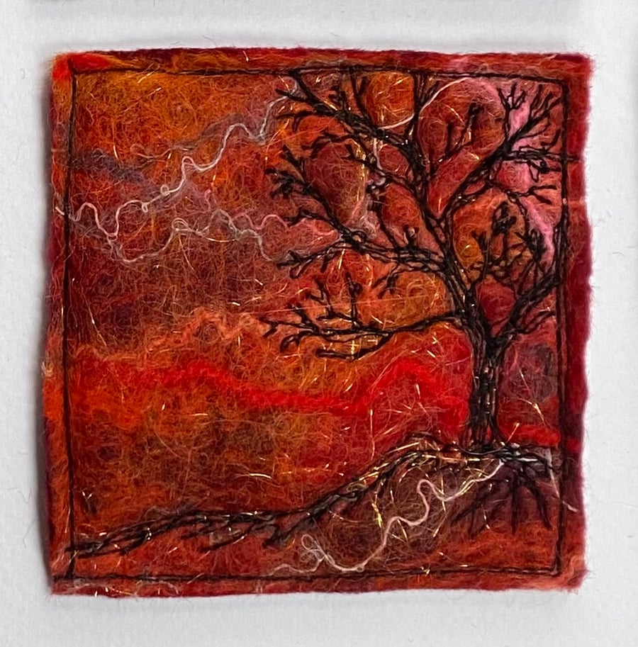 Tree silhouette with sunrise, original wet felting artwork.