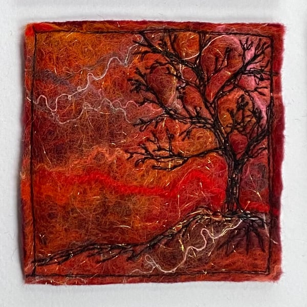 Tree silhouette with sunrise, original wet felting artwork.