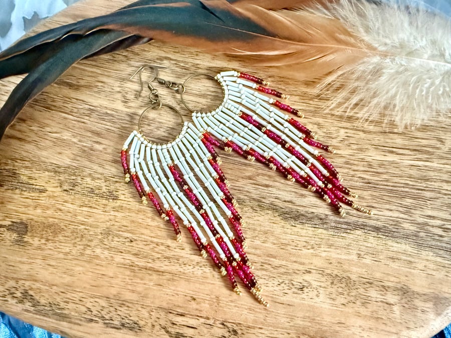 Cream and pink beadwork fringe earrings on bronze hoops