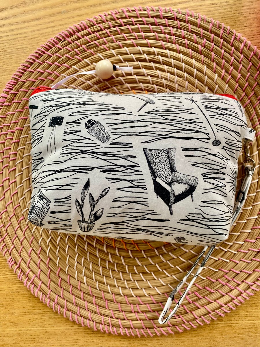 Handmade zipped clutch or purse in ‘Homemaker’ style fabric with wrist strap