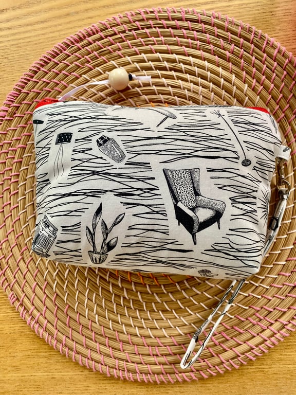 Handmade zipped clutch or purse in ‘Homemaker’ style fabric with wrist strap