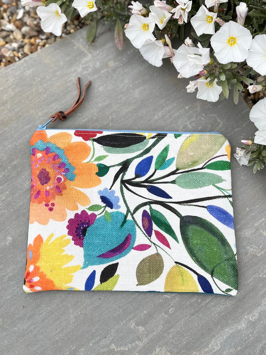 Bright floral linen zip pouch with teal twill back and leopard print lining