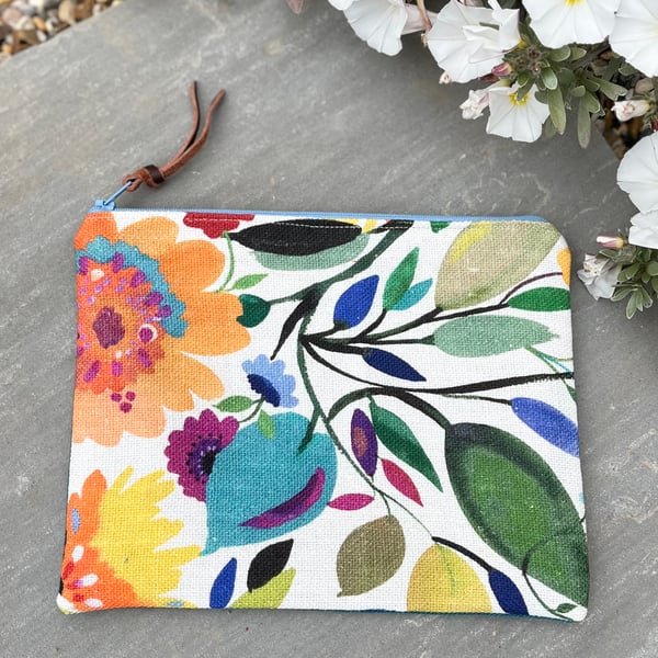 Bright floral linen zip pouch with teal twill back and leopard print lining