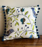 Bird cushion cover with embroidery and pompoms and reclaimed denim back