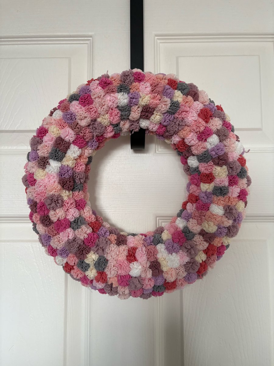 Pretty scrunchy Pom Pom wreath. 