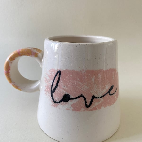 Yellow spot handle ceramic love mug.