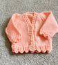Peach baby cardigan hand knitted lacy pattern newborn 