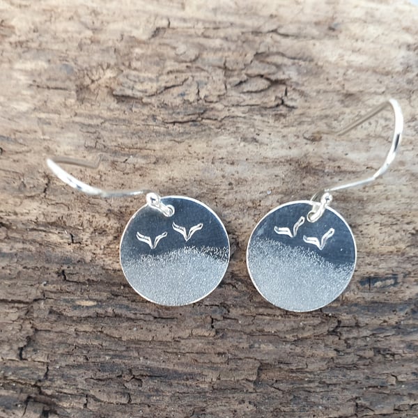 Silver beach themed earrings with seagulls