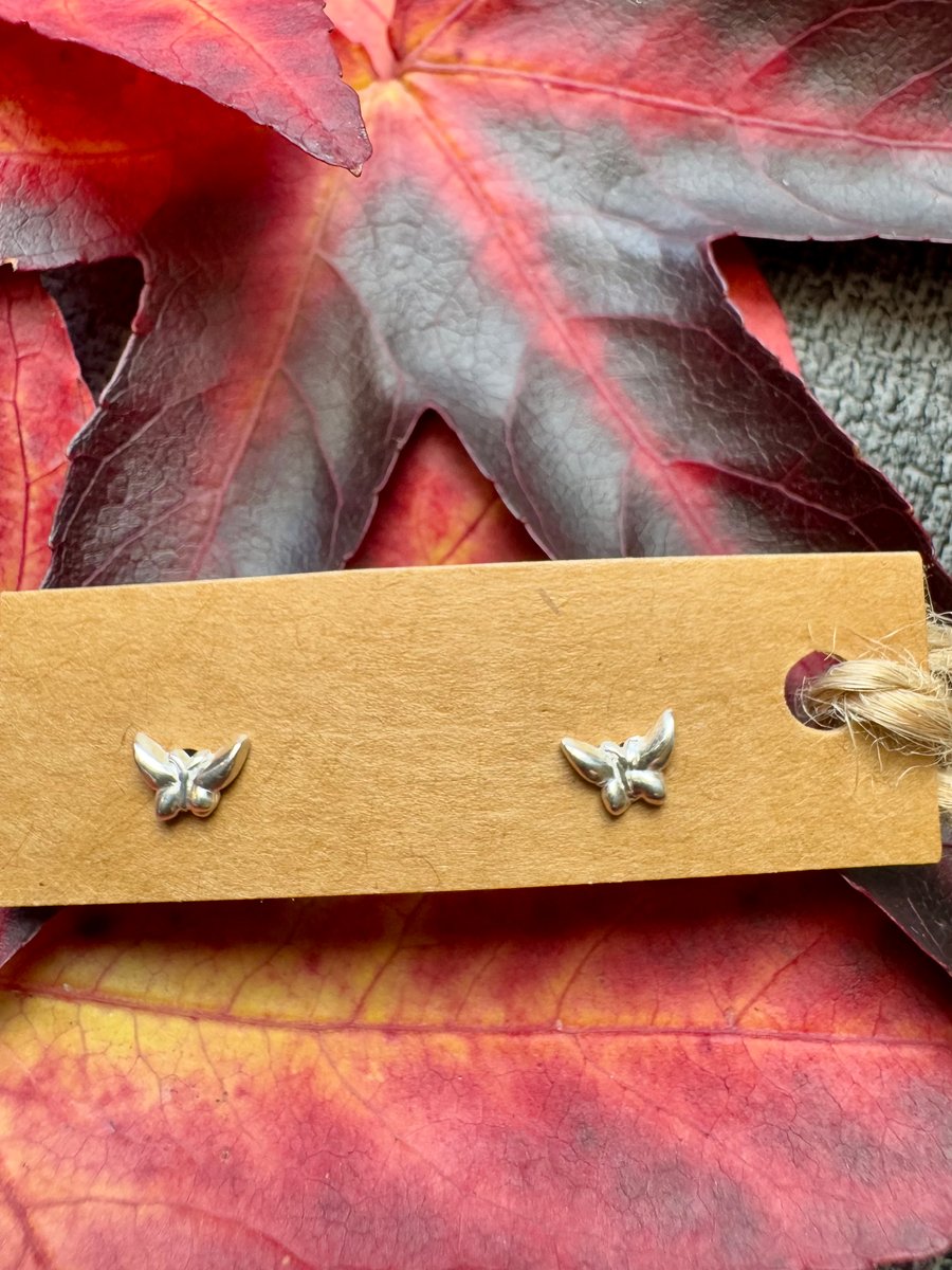 Tiny little silver butterfly stud earrings 