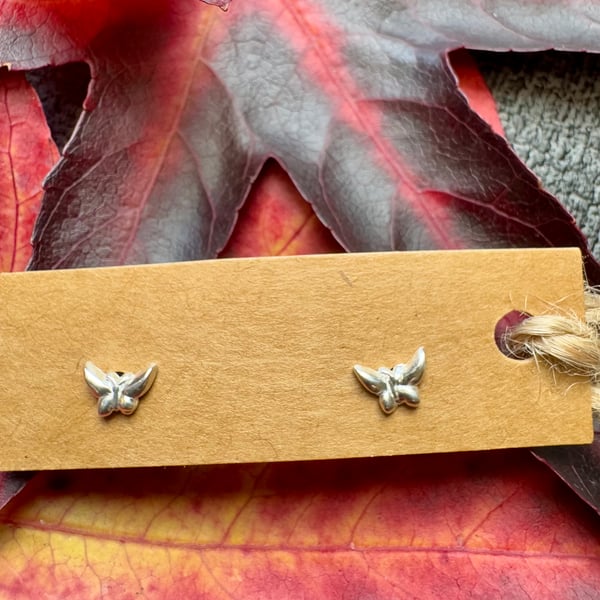 Tiny little silver butterfly stud earrings 