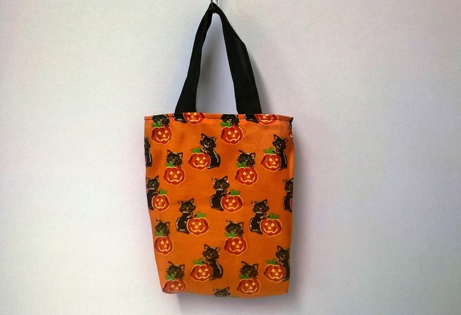 Halloween trick or treat bag, orange with pumpkins & black cats, reversible