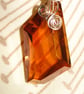 Wire wrapped copper coloured Swarovski Crystal Pendant on a gold chain Rare - Image 1
