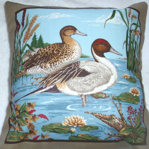 Two ducks side by side in a river with reeds and waterlilies 10" cushion