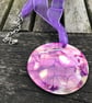 Purple patterned shell on purple ribbon - Image 1