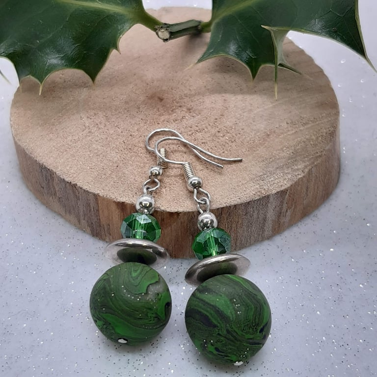 Green, black and silver dangly earrings