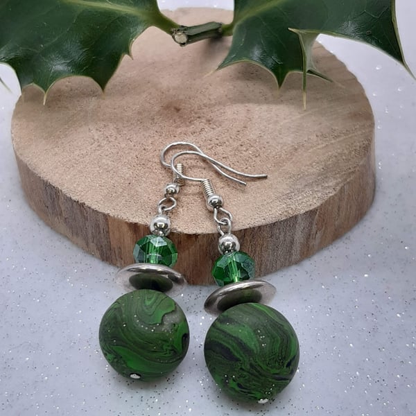 Green, black and silver dangly earrings