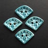 Set of four small turquoise ceramic buttons