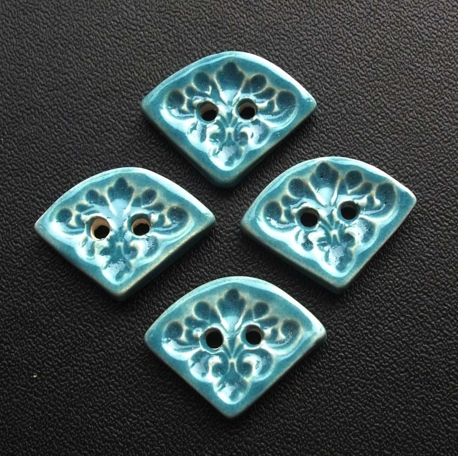 Set of four small turquoise ceramic buttons
