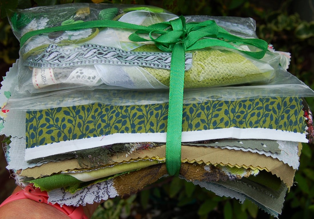 Upcycled slow stitching kit includes fabric, buttons, thread, lace, ribbon