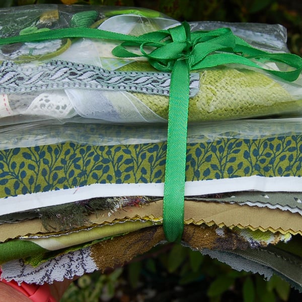 Upcycled slow stitching kit includes fabric, buttons, thread, lace, ribbon