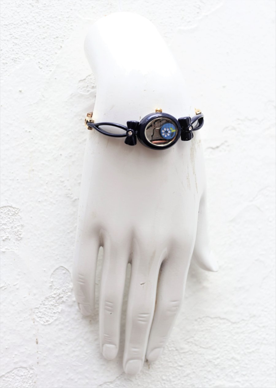 Upcycled ladies watch decorated with a flower bead handmade bracelet