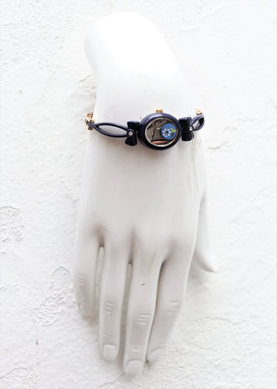 Upcycled ladies watch decorated with a flower bead handmade bracelet