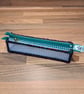 Pencil case - see-through with red, green, navy edge, green zip, yellow charm - Image 1