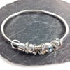 Silver blue topaz and gold bangle  No Worries Bangle