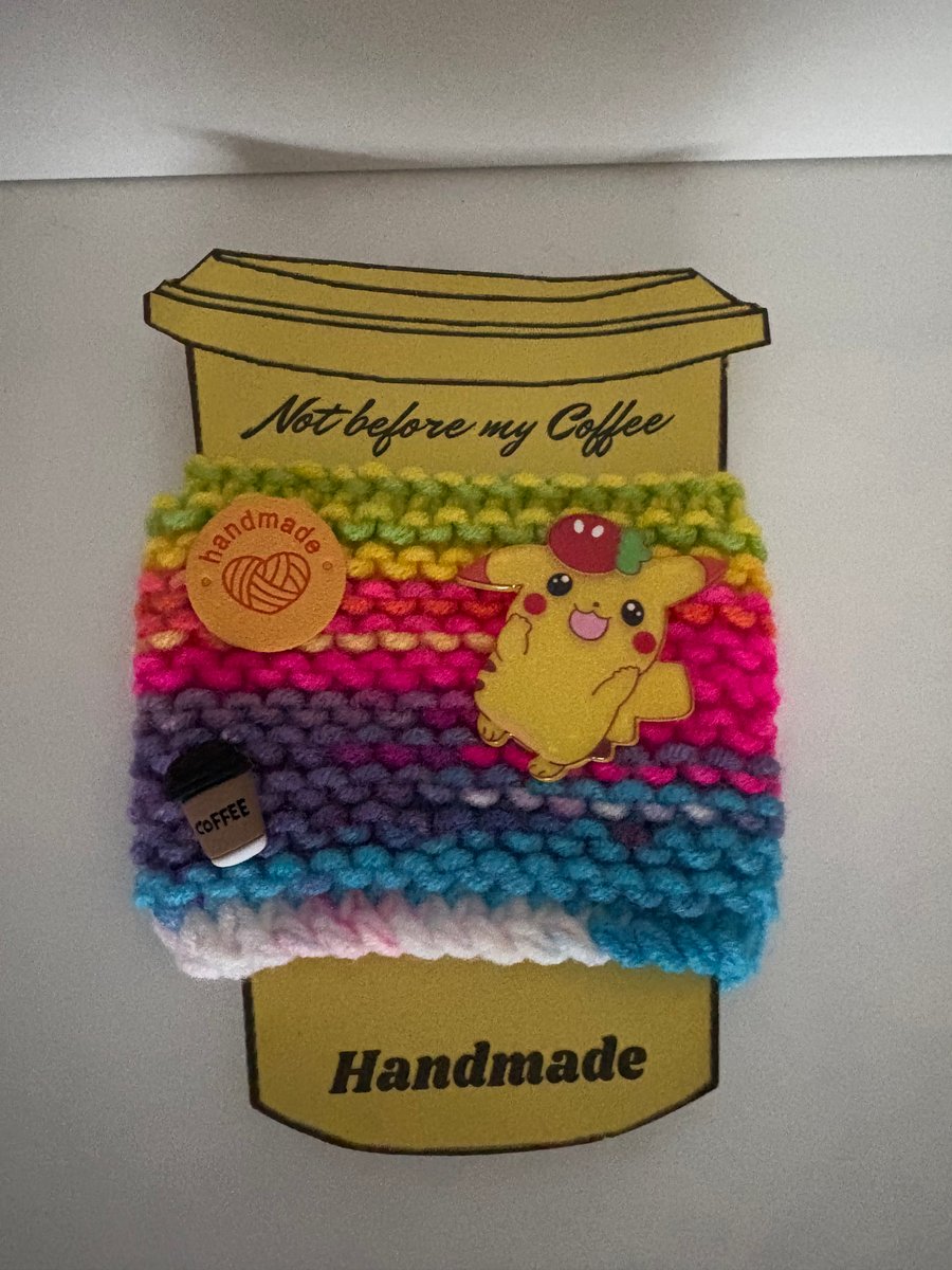 Pikachu knitted cup cosy. 