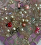 A wooden heart shaped pendant with a mauve theme and glass beads. - Image 3