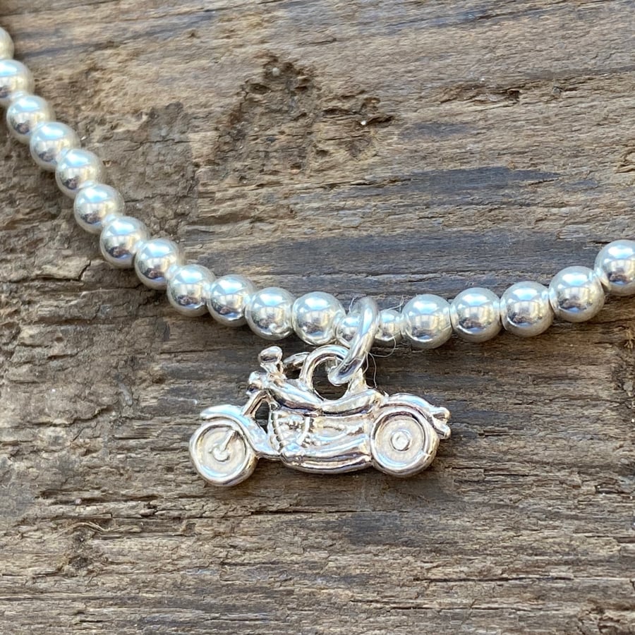 Sterling silver bead bracelet with motorbike charm. Stretch bracelet. 