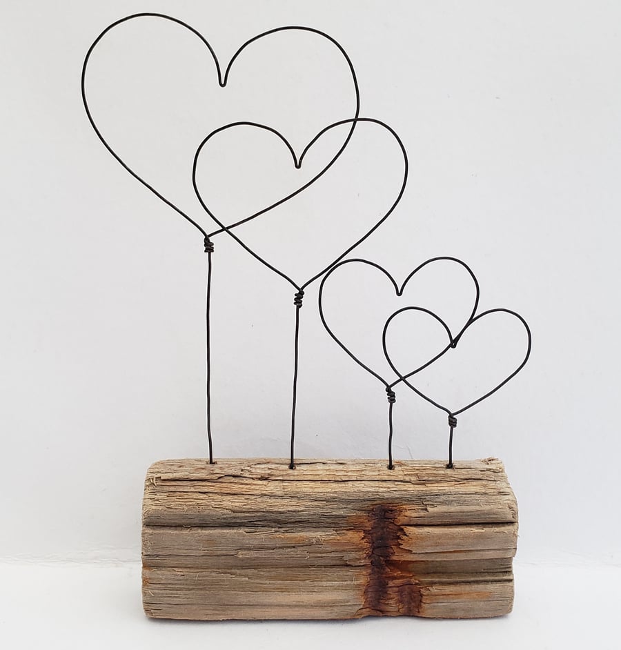 'Us & the Kids'  driftwood and wire hearts.