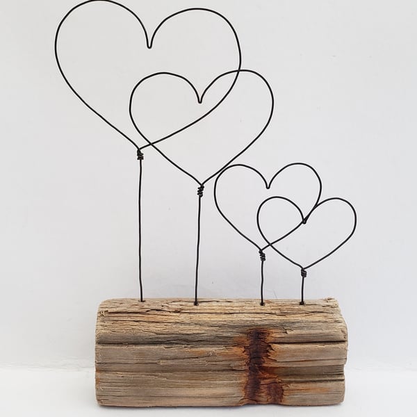 'Us & the Kids'  driftwood and wire hearts.