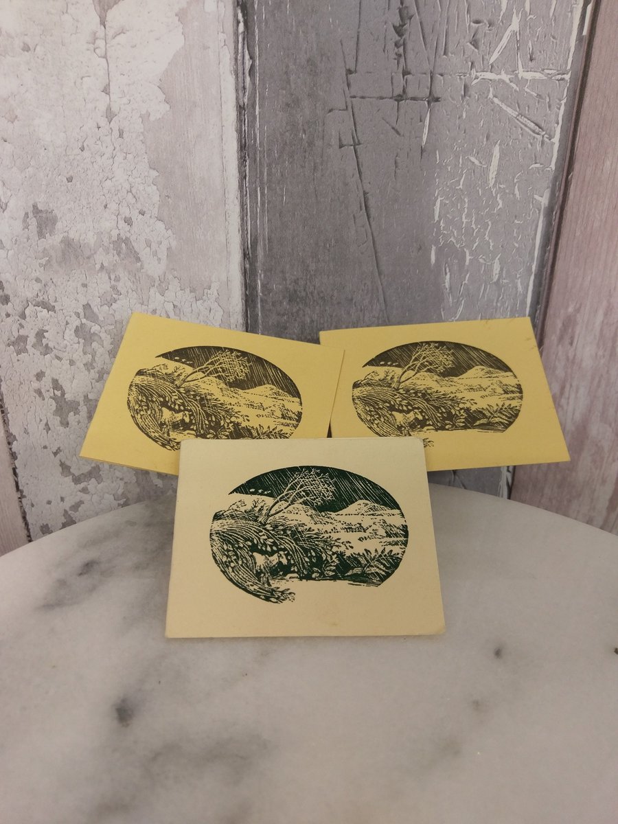 3 hand stamped gift tags with a design of a windblown hilltop