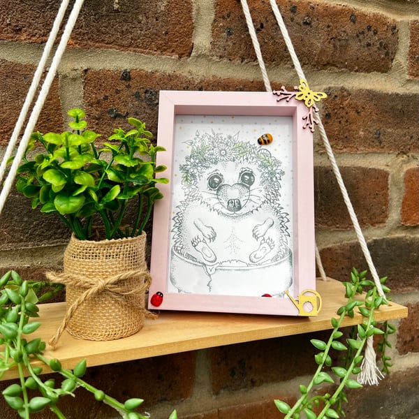 Hedgehog illustration in a pink themed frame