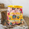 Bright floral design storage pouch with velvet hanging loop