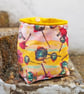 Bright floral design storage pouch with velvet hanging loop