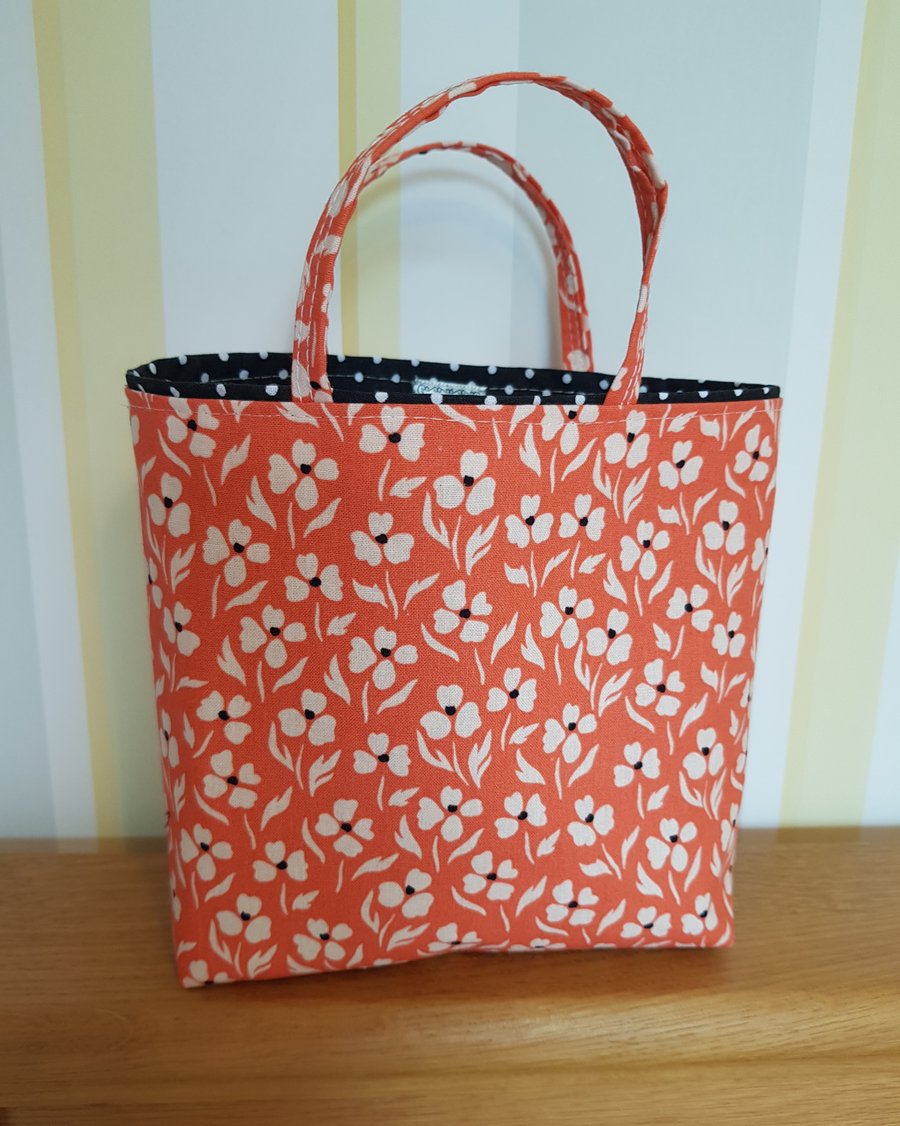 Reusable fabric gift bag; small floral design on salmon pink