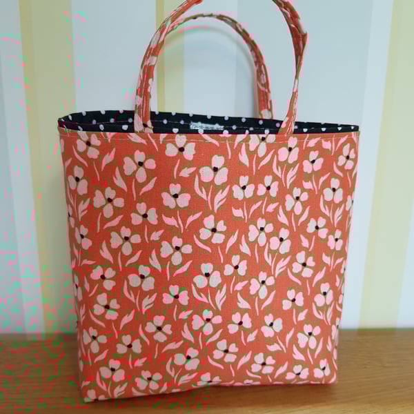 Reusable fabric gift bag; small floral design on salmon pink